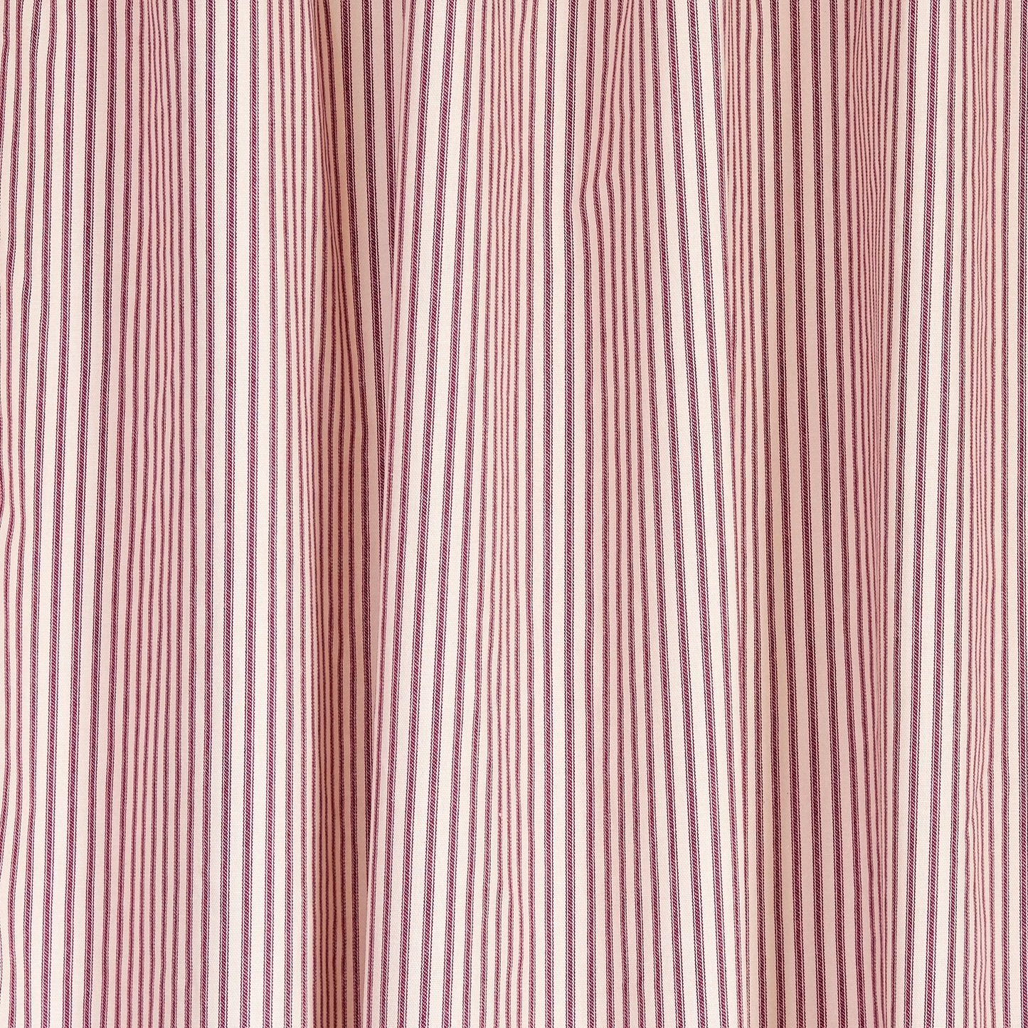 red ticking stripe fabric close up