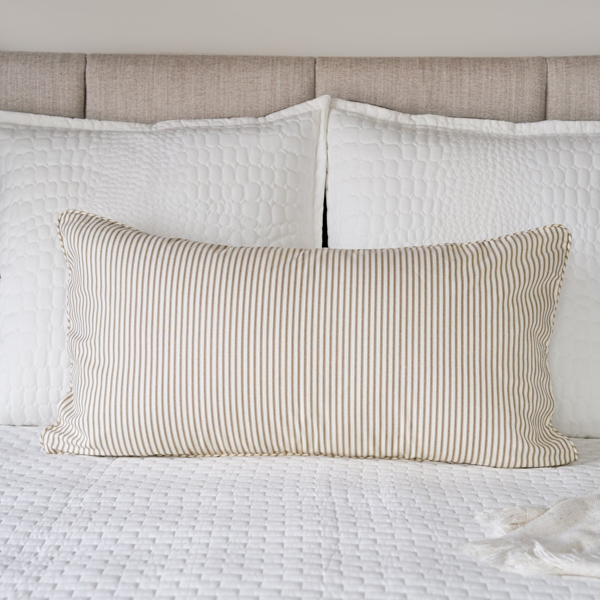 brown striped ticking pillow sham king size on bed