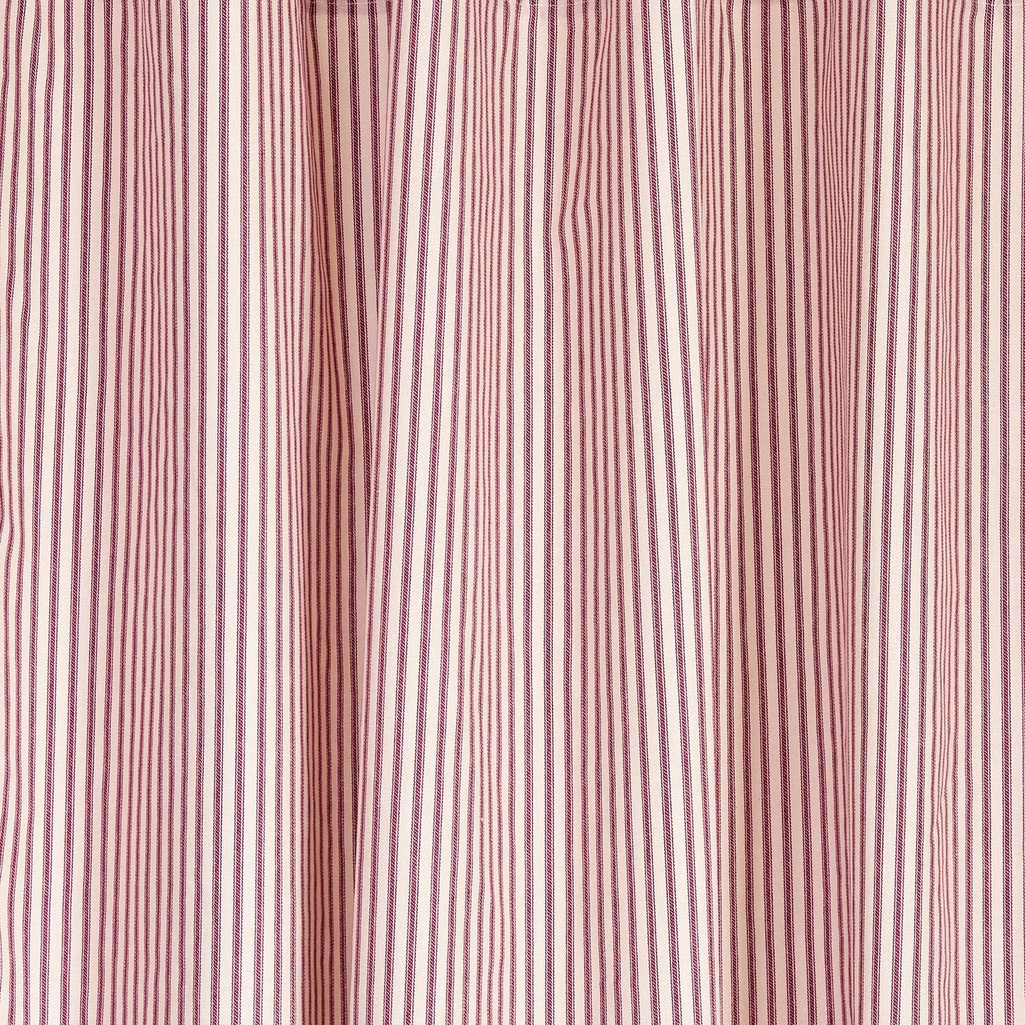 red and antique ivory fabric swatch close up
