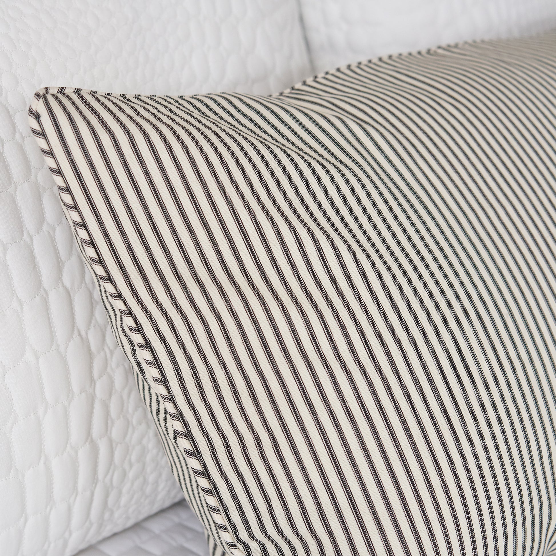 ticking stripe pillow sham detail black and cream ticking on bed
