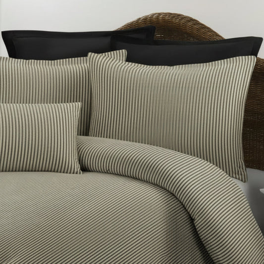 striped bedding shown on a studio background 